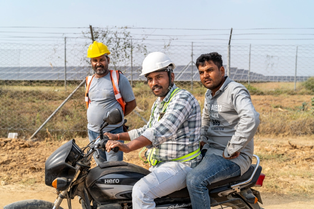 Workers heading for lunch after finishing their shift at the construction site of a solar power plant near Mundra, Gujarat